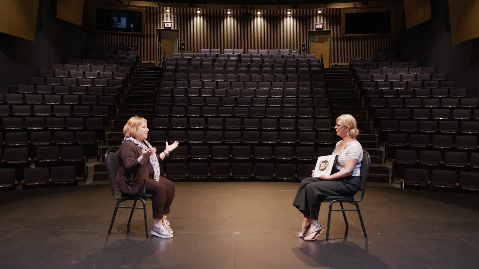 Theatre-seat interview frame from the ArtsCO artist series.