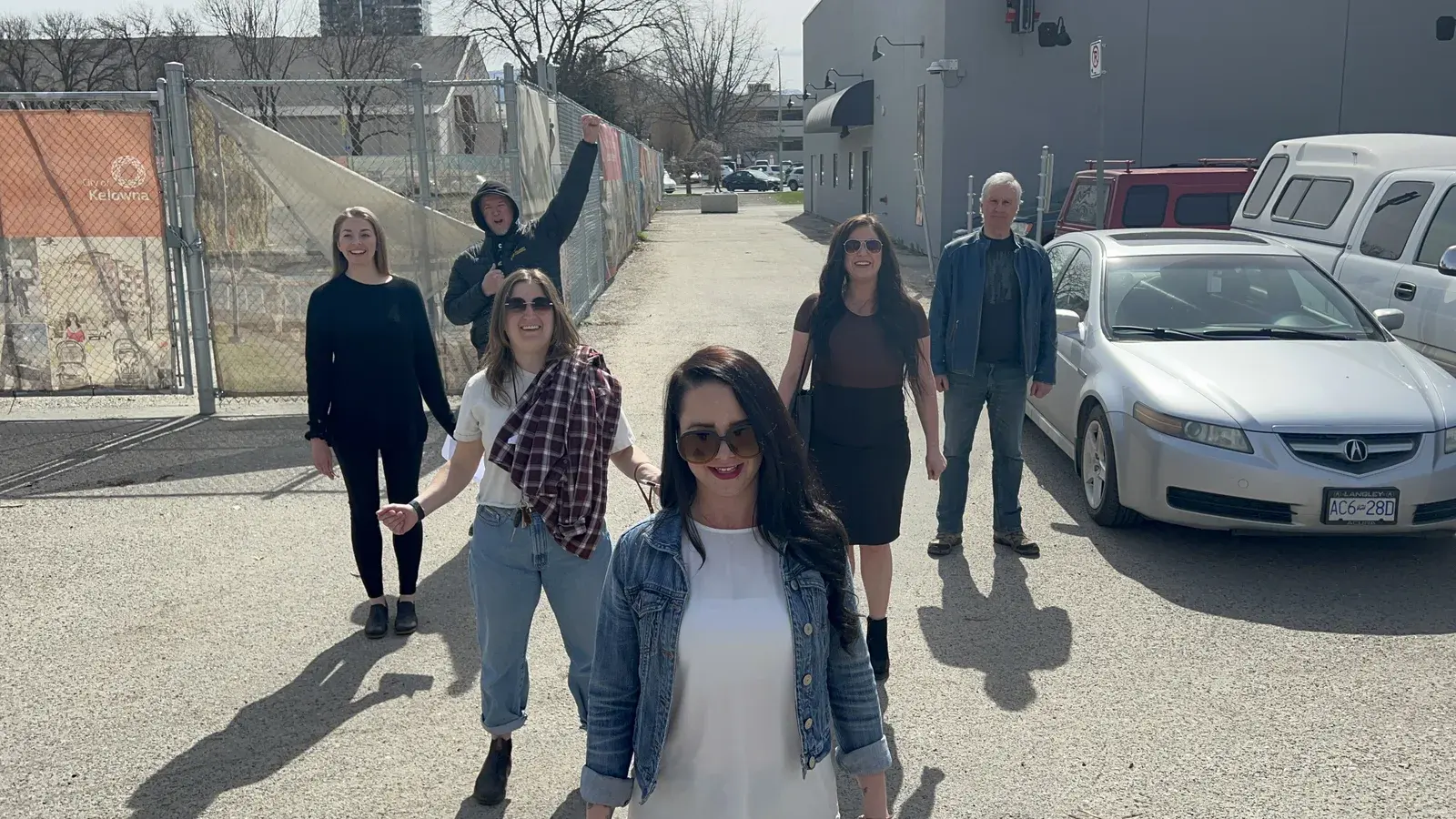 BrainTrust Canada performers rehearse the one-take blocking outdoors.