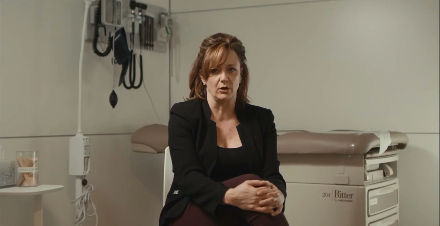 Ginny Becker speaks from a child-support examination room.