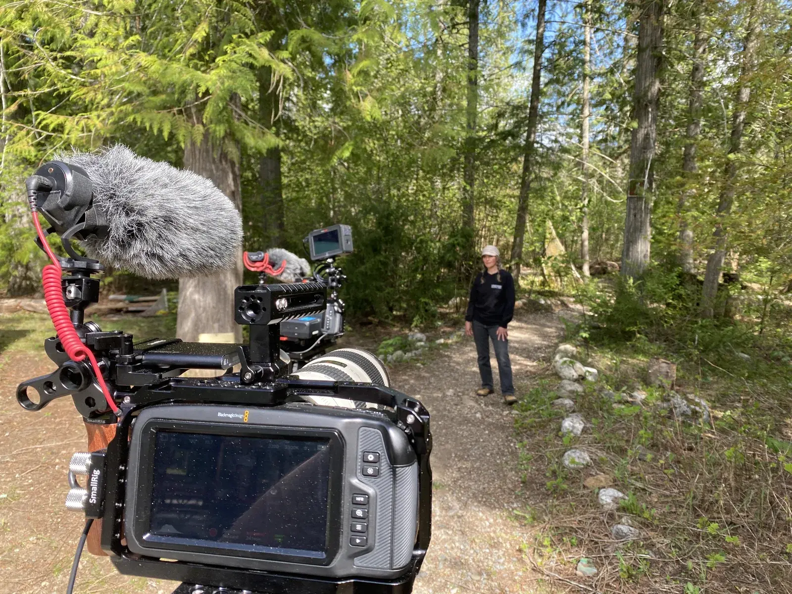 Camera and audio rig filming an instructor on the Kingfisher forest trail.