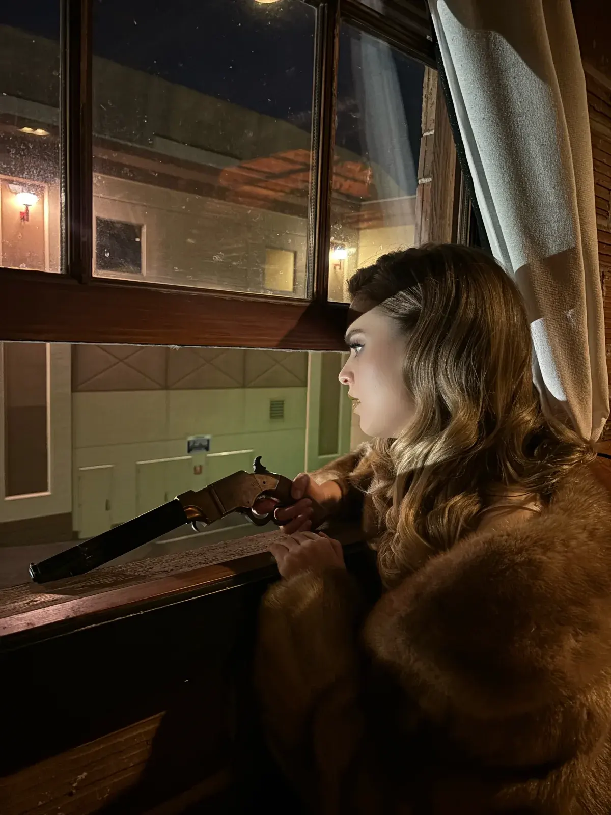 Hannah Krostewitz framed by a window during Last of a Dying Breed production