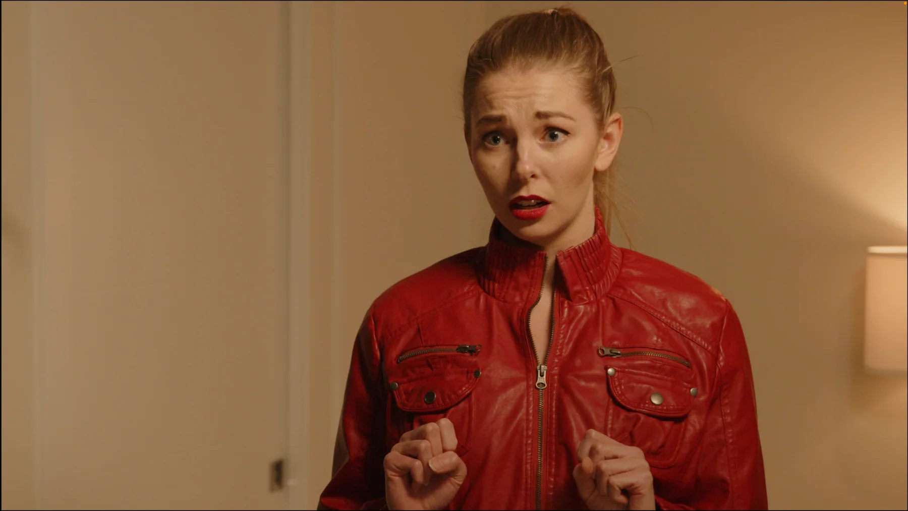 Close frame of the actor in the red jacket from The Gift.